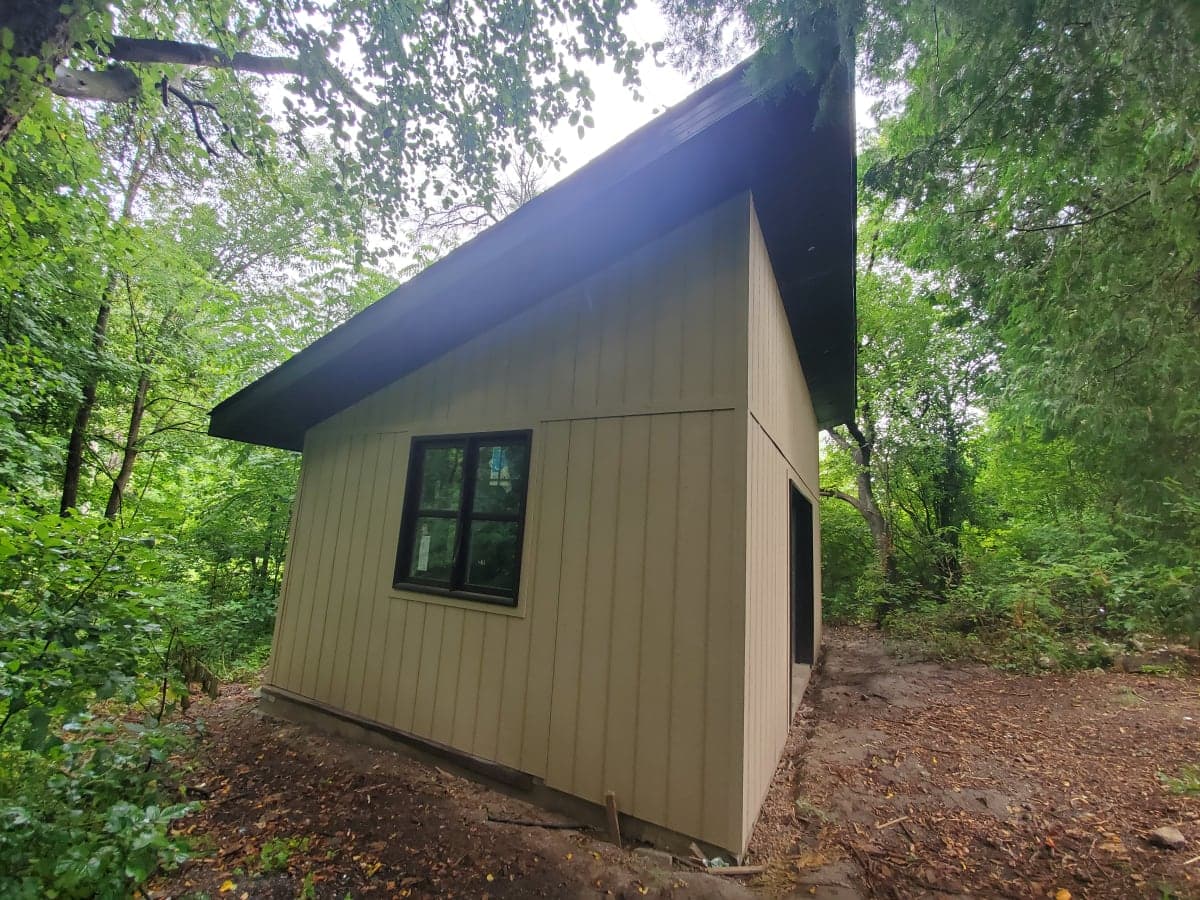 Garage construction site in spring with foundation work underway