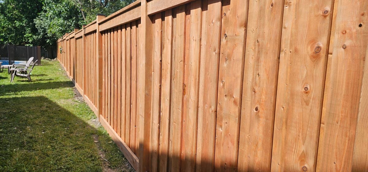 Close-up of cedar fence boards with stainless steel screws