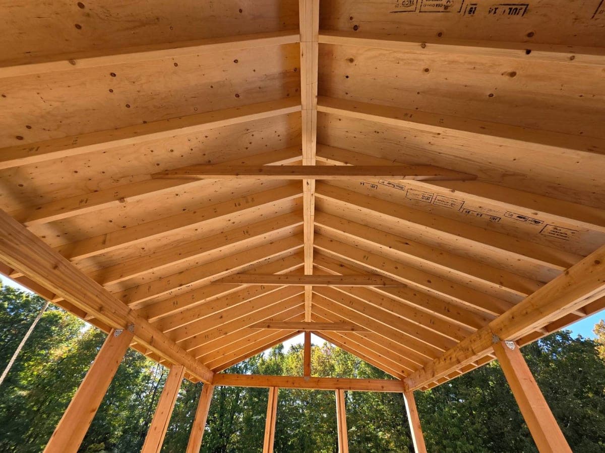Roofing site setup in spring with materials organized and gravel ground