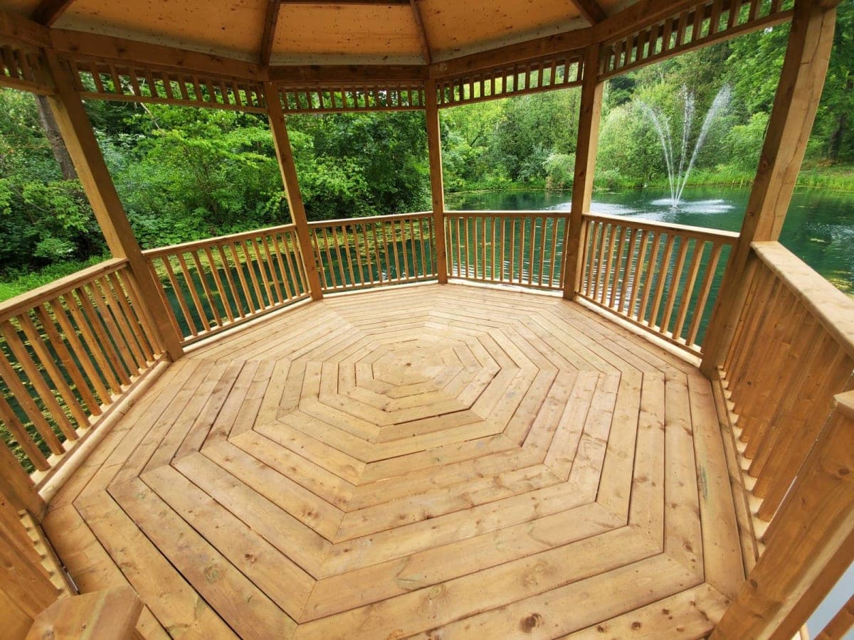 Completed gazebo-pergola hybrid outdoors with snow