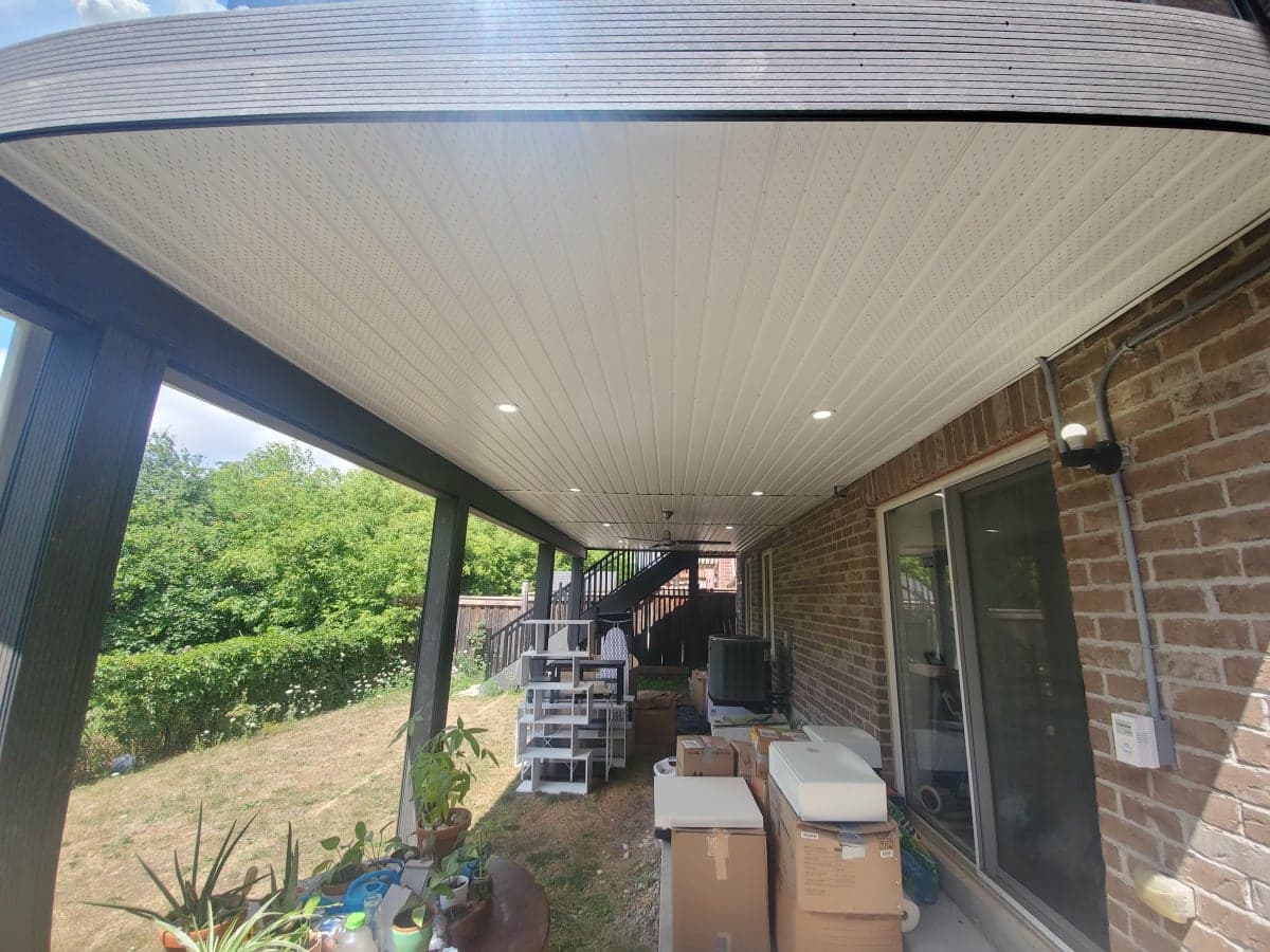 Outdoor lighting on a Canadian home exterior at dusk
