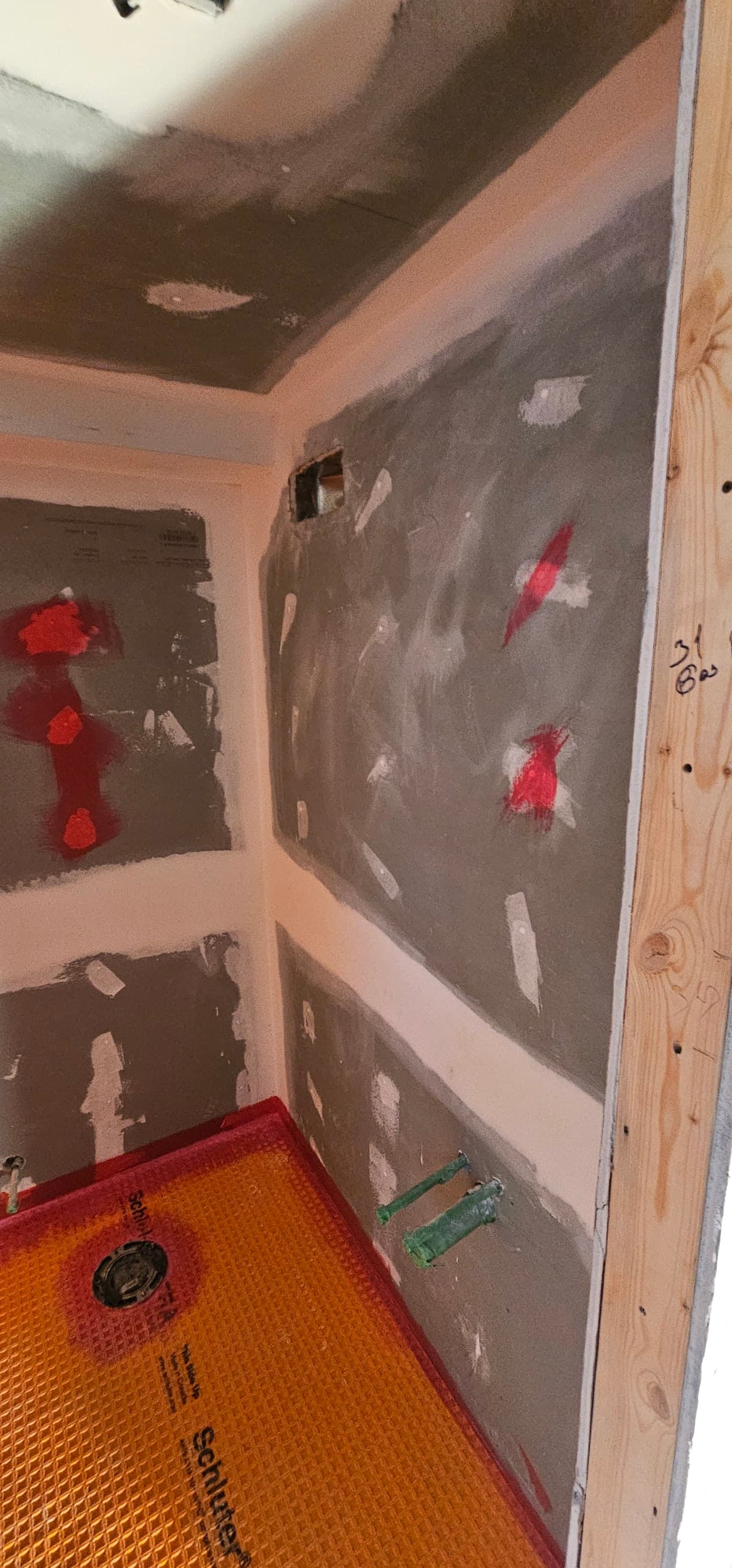 Interior home renovation work in progress with exposed framing and drywall