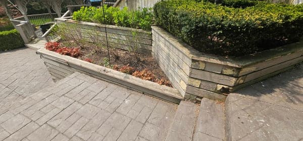 Construction of a stone retaining wall on a sloped yard