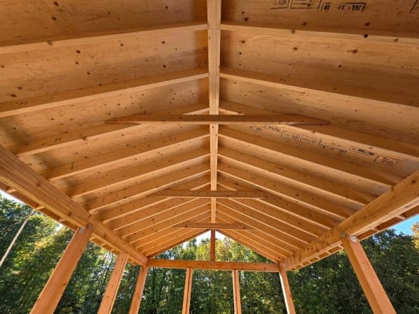 Roofing site setup in spring with materials organized and gravel ground