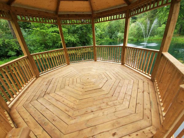 Completed gazebo-pergola hybrid outdoors with snow